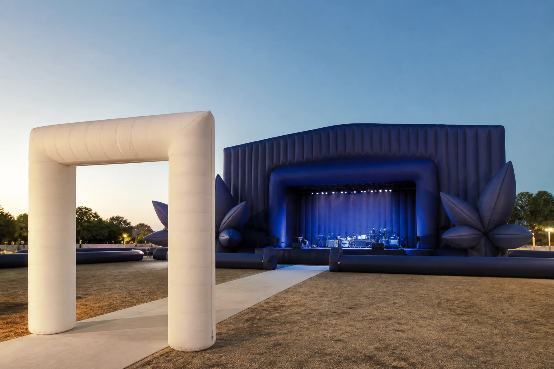 Inflatable stage backdrop side sculptures and entrance portal at a live event