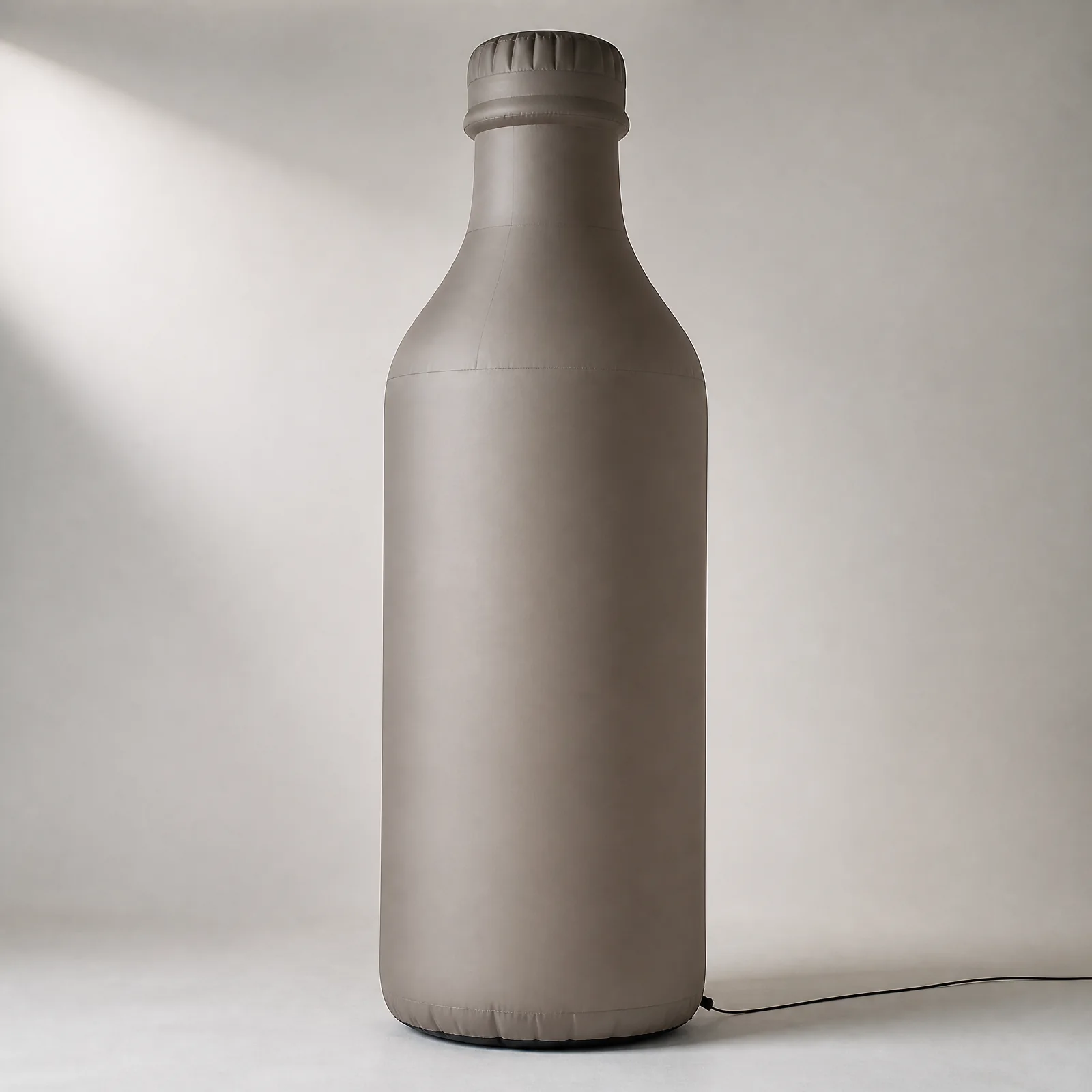 Tall inflatable bottle with a narrow neck and shaped cap