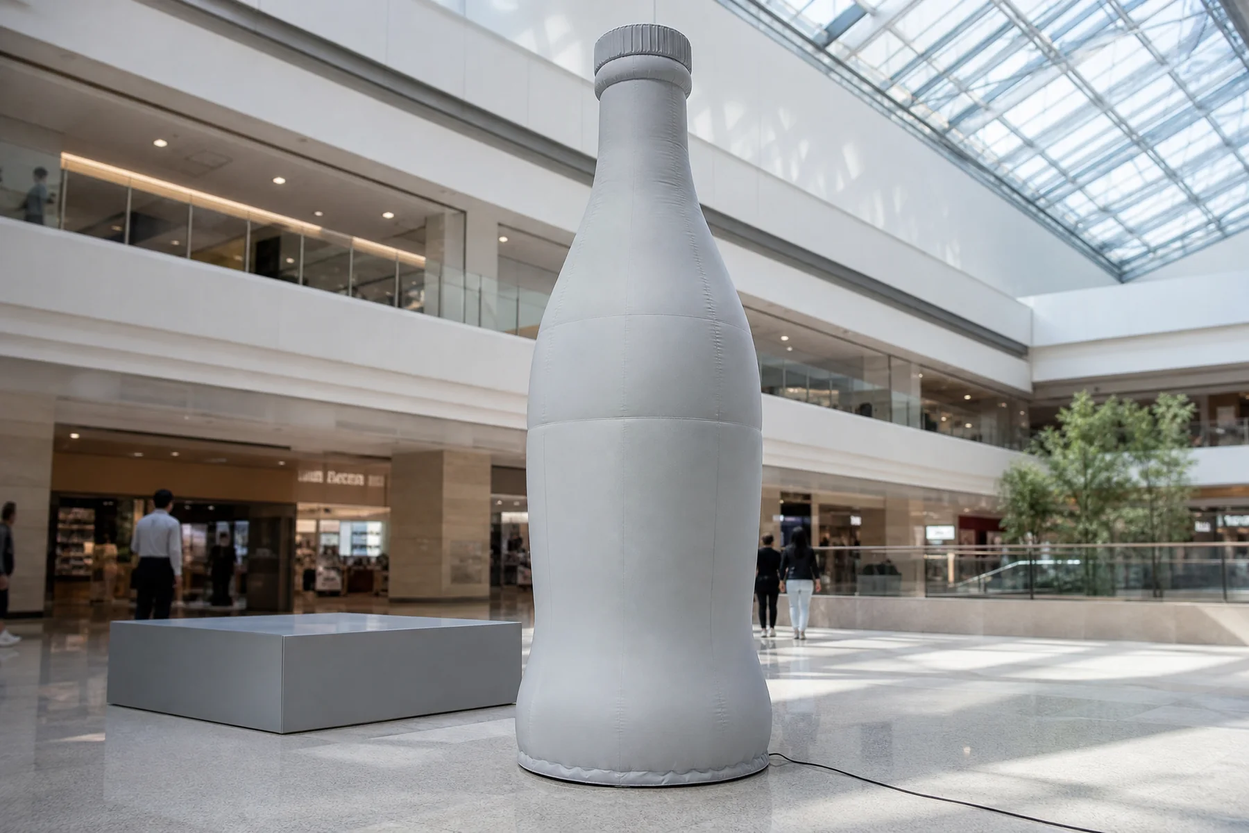 Tall inflatable bottle with a narrow neck and shaped cap