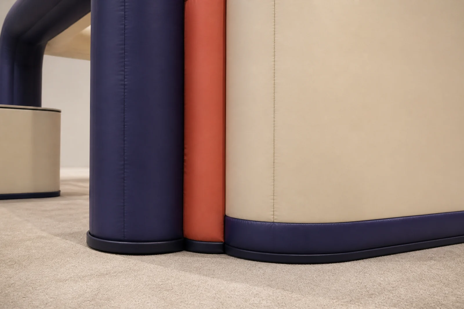 Close view of grounded navy, cream, and coral columns on a fan-engagement installation.